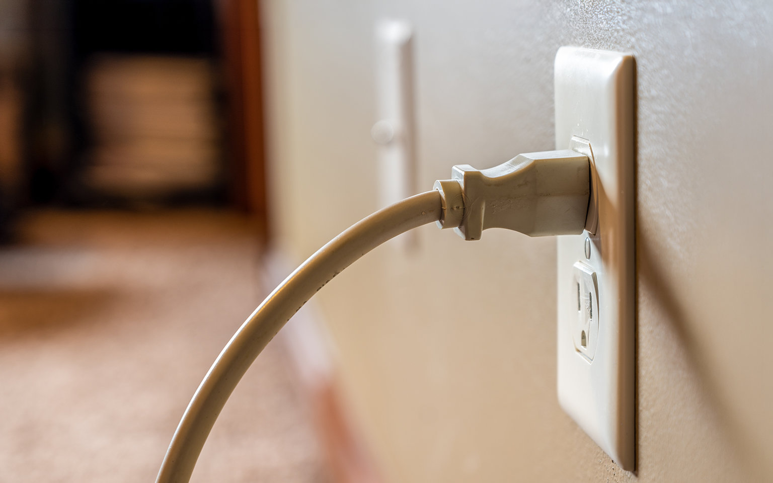 Power cord plugged into a standard wall outlet that is not working.
