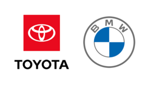Toyota red badge logo side by side with the BMW roundel emblem.